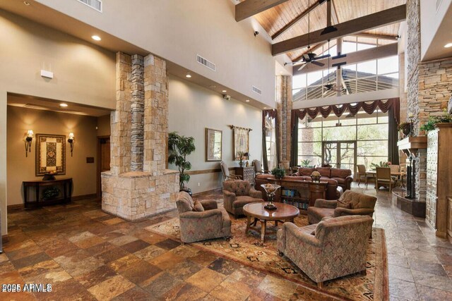 lobby featuring high vaulted ceiling and beamed ceiling