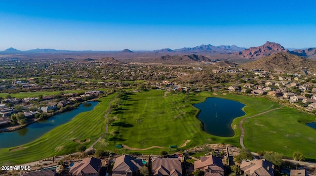 aerial view of residential area featuring a water and mountain view and a golf club