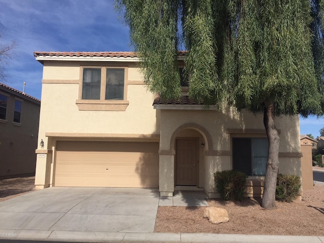 mediterranean / spanish-style home featuring a garage