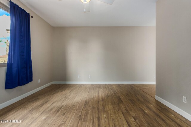 unfurnished room featuring ceiling fan and hardwood / wood-style floors