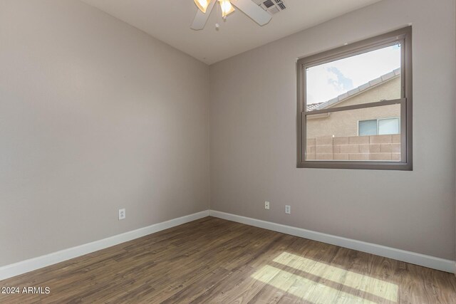 empty room with wood-type flooring and ceiling fan