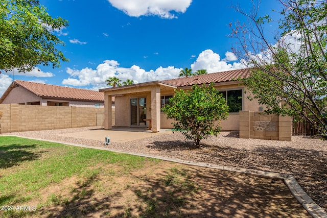 back of property featuring a patio area