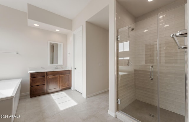 bathroom with vanity and a shower with door