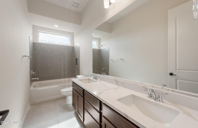 full bathroom featuring vanity, tile patterned floors, tiled shower / bath combo, and toilet