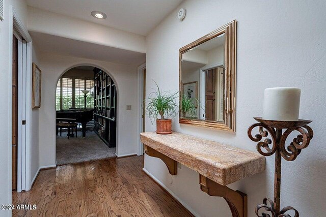 corridor with dark wood-type flooring