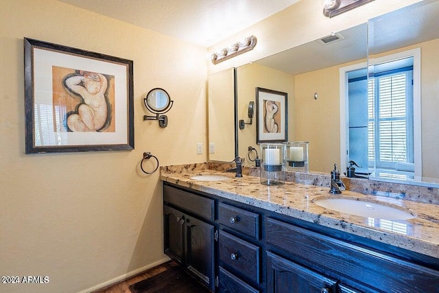 bathroom featuring vanity and hardwood / wood-style floors