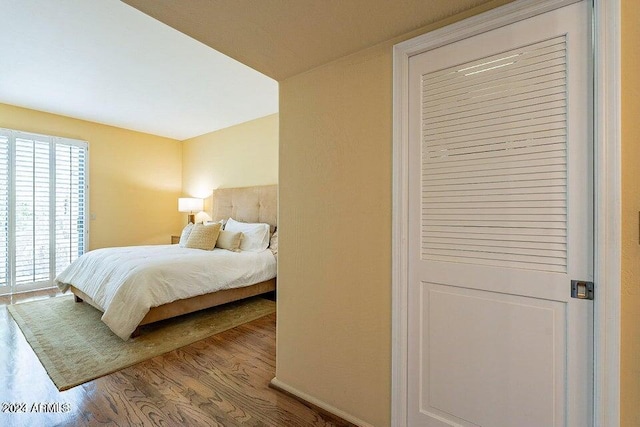 bedroom with wood-type flooring