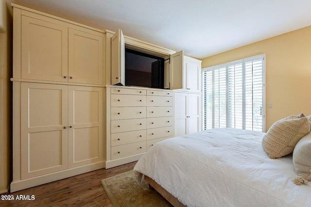 bedroom with hardwood / wood-style flooring