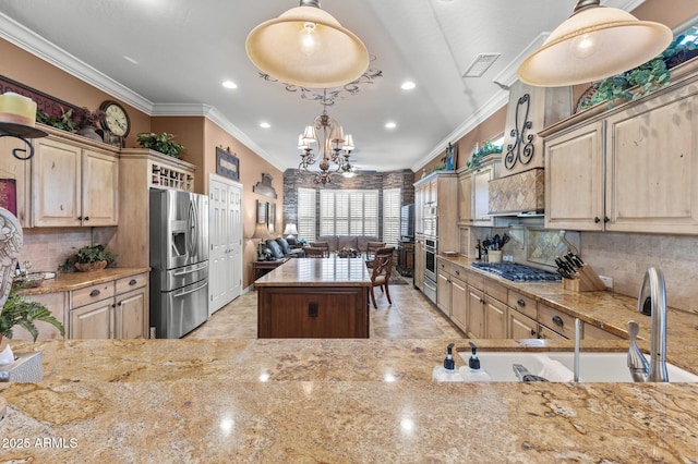 kitchen with a center island, stainless steel appliances, an inviting chandelier, tasteful backsplash, and pendant lighting