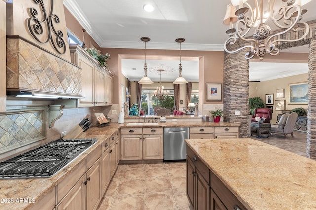 kitchen featuring sink, light stone counters, a chandelier, decorative backsplash, and appliances with stainless steel finishes