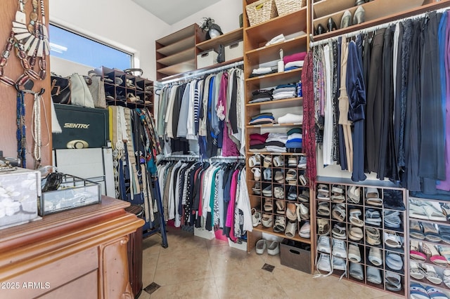 walk in closet with tile patterned flooring