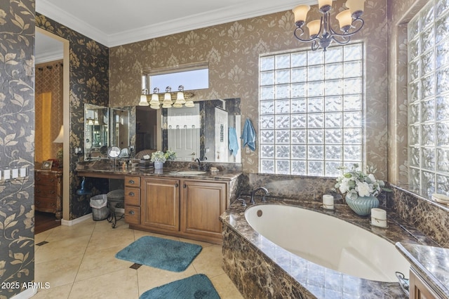 bathroom featuring vanity, tile patterned flooring, ornamental molding, tiled bath, and a chandelier