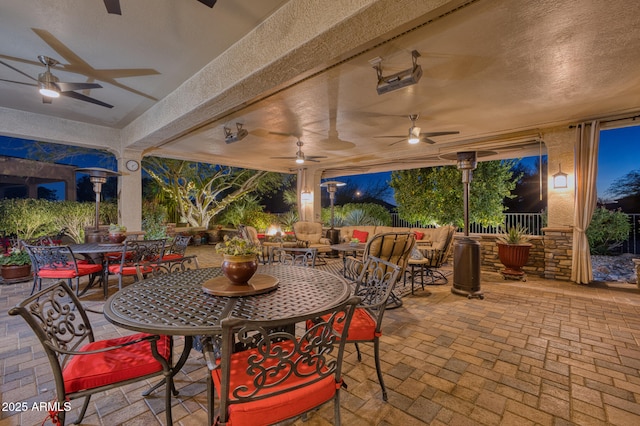 view of patio / terrace featuring ceiling fan