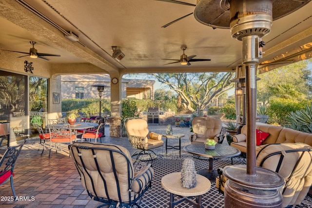 view of patio featuring ceiling fan and an outdoor living space