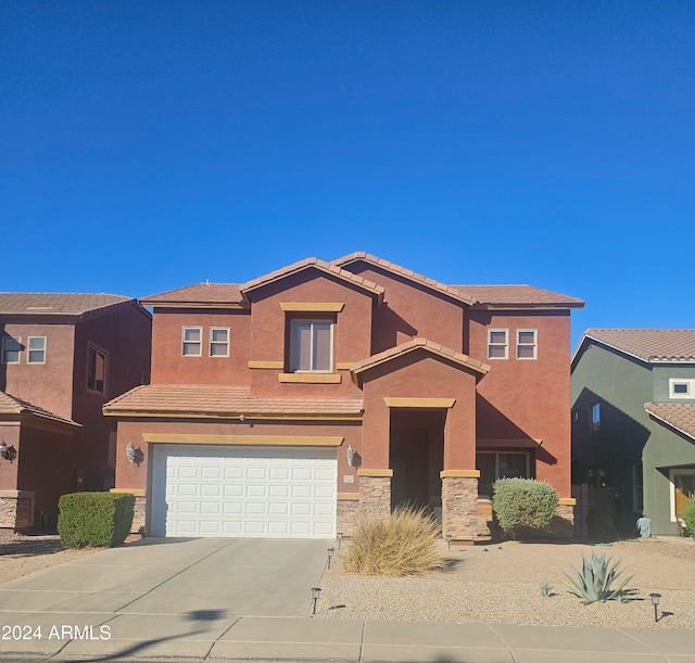 view of front of property with a garage