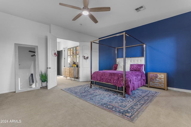 bedroom featuring light colored carpet and ceiling fan