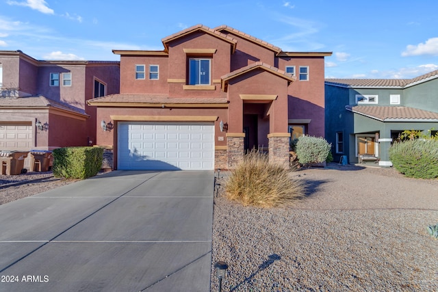 964 W Saguaro Ln, San Tan Valley, AZ 85143 - view of property featuring driveway, a tiled roof, a garage, stucco siding, and stone siding
