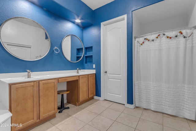 964 W Saguaro Ln, San Tan Valley, AZ 85143 - bathroom featuring tile patterned floors, double vanity, and baseboards