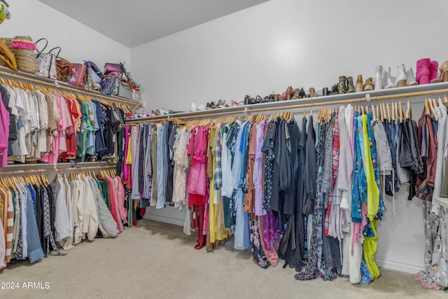 walk in closet featuring carpet