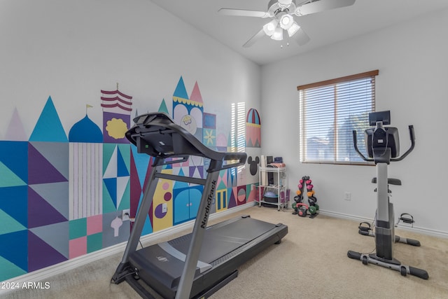 exercise area with ceiling fan and carpet