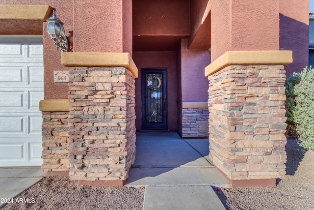 964 W Saguaro Ln, San Tan Valley, AZ 85143 - property entrance featuring stucco siding, a garage, and stone siding