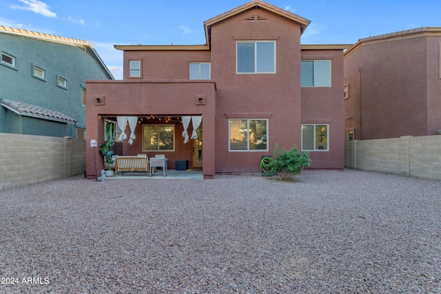 back of house featuring a patio area