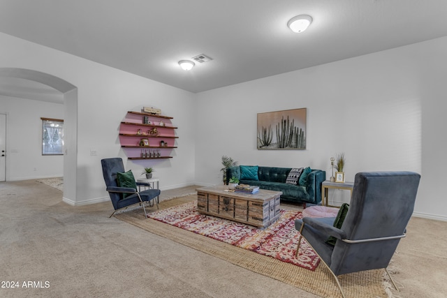 964 W Saguaro Ln, San Tan Valley, AZ 85143 - living room with arched walkways, carpet flooring, and baseboards