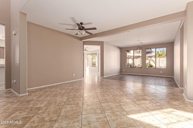 tiled empty room featuring ceiling fan with notable chandelier