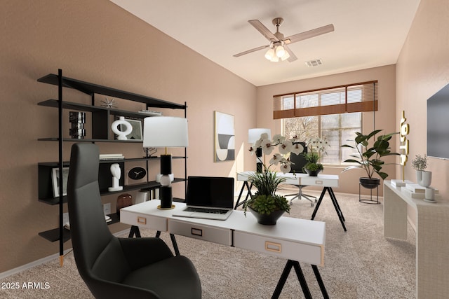 home office with light carpet and ceiling fan