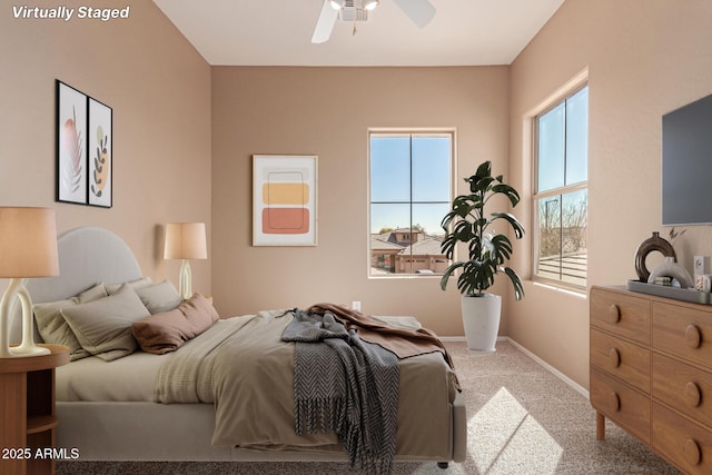 carpeted bedroom with ceiling fan