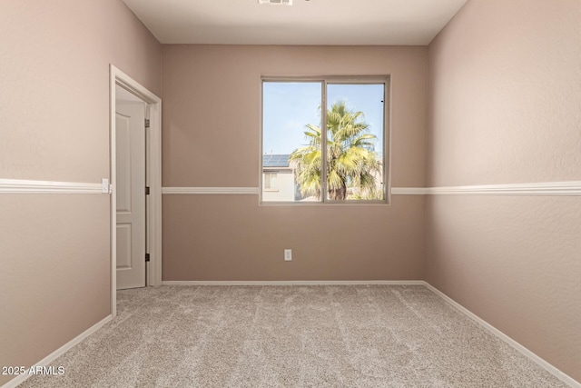 empty room featuring light carpet