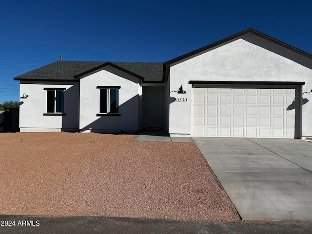 single story home featuring a garage