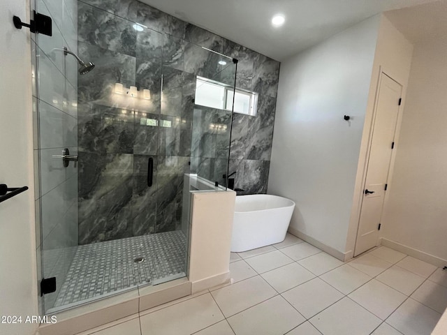 bathroom with shower with separate bathtub and tile patterned floors