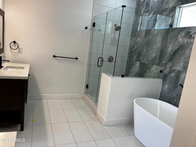 bathroom featuring vanity, tile patterned floors, and independent shower and bath