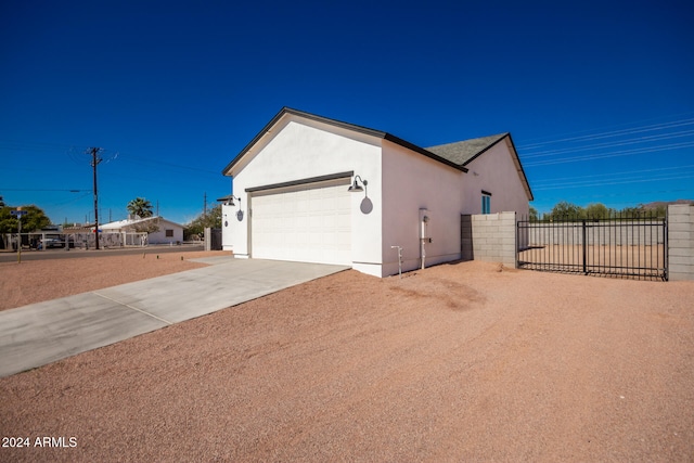 view of side of home featuring a garage