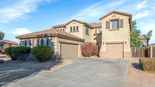 mediterranean / spanish-style house featuring a garage