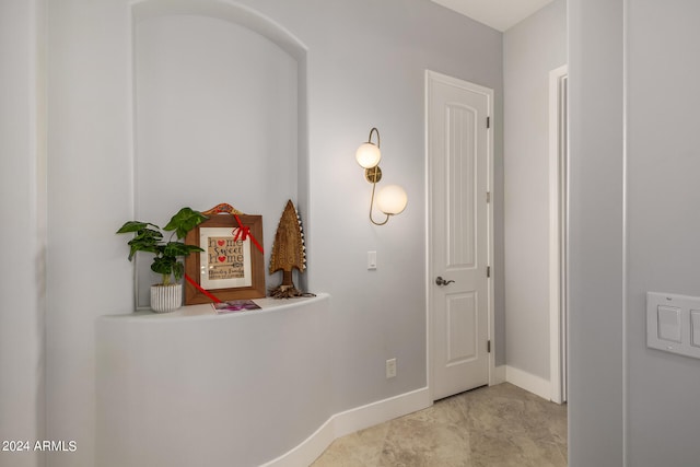 corridor with light tile patterned floors