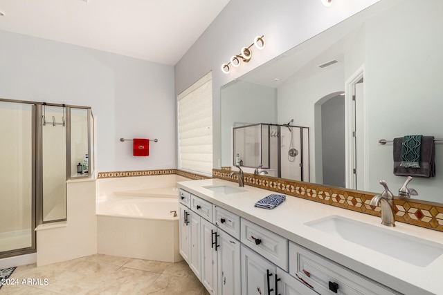 bathroom featuring dual vanity, separate shower and tub, and tile patterned flooring