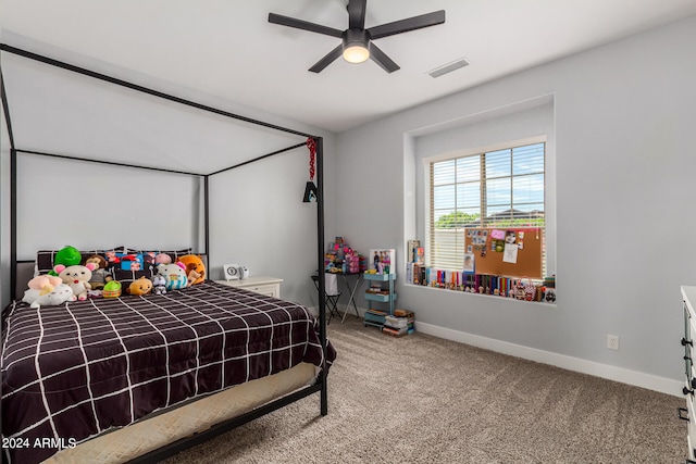 bedroom featuring ceiling fan and carpet