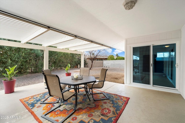 view of patio with a pergola, outdoor dining area, and fence