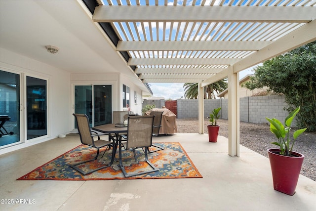 view of patio / terrace with a fenced backyard, outdoor dining space, and a pergola