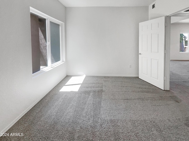 spare room featuring carpet
