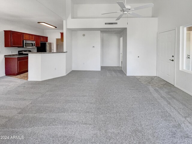 kitchen featuring appliances with stainless steel finishes, kitchen peninsula, sink, and light tile patterned floors