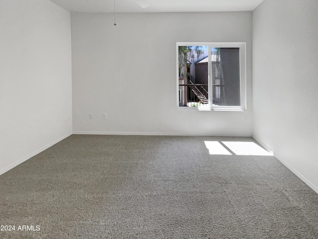 kitchen featuring stainless steel appliances, light carpet, ceiling fan, and kitchen peninsula