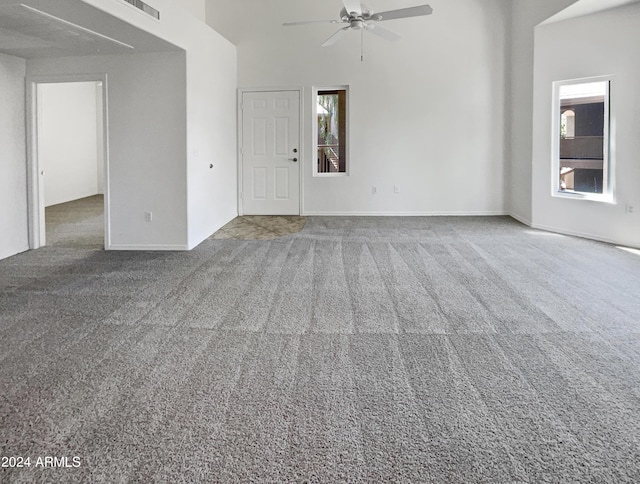kitchen featuring appliances with stainless steel finishes, light carpet, and hanging light fixtures