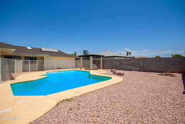 view of swimming pool with a patio, a fenced backyard, a fenced in pool, and a pergola