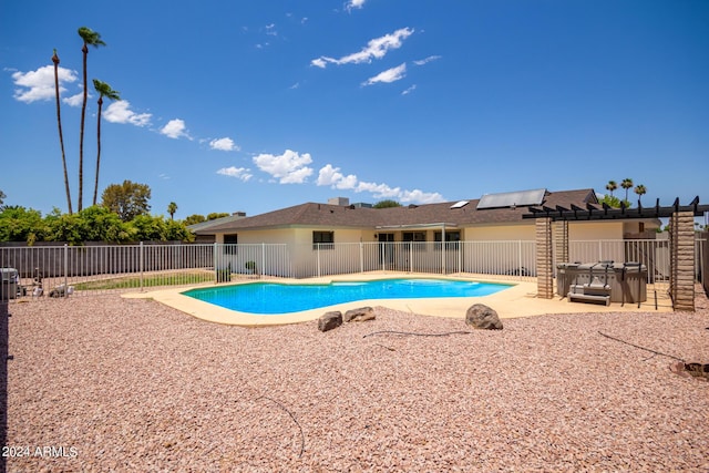 view of pool with a patio area, a fenced backyard, and a fenced in pool