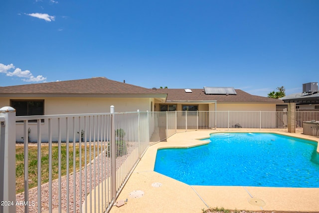 view of swimming pool featuring a fenced in pool, fence, and a patio