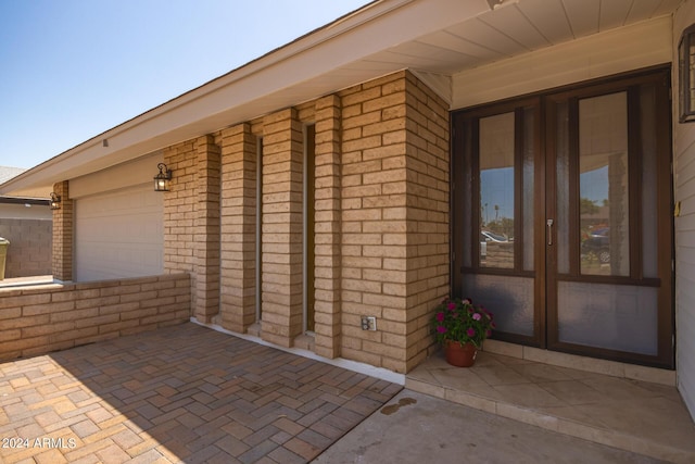 view of patio featuring an attached garage