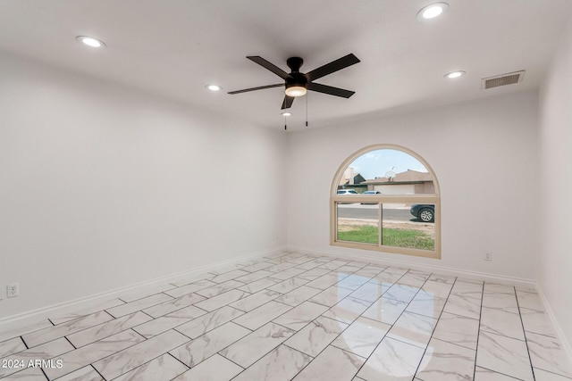 spare room with baseboards, visible vents, a ceiling fan, marble finish floor, and recessed lighting